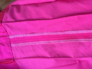 Finished edges and top-stitched pleats